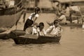 Young children go to school in boatÃÂ on the Tonle sap River Royalty Free Stock Photo